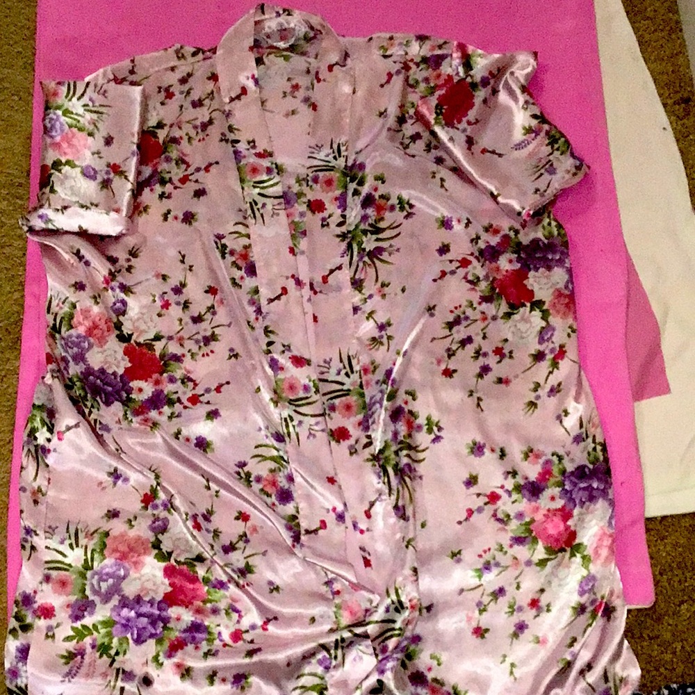 I am selling a pink floral robe. The brand of the robe is Pretty Robes